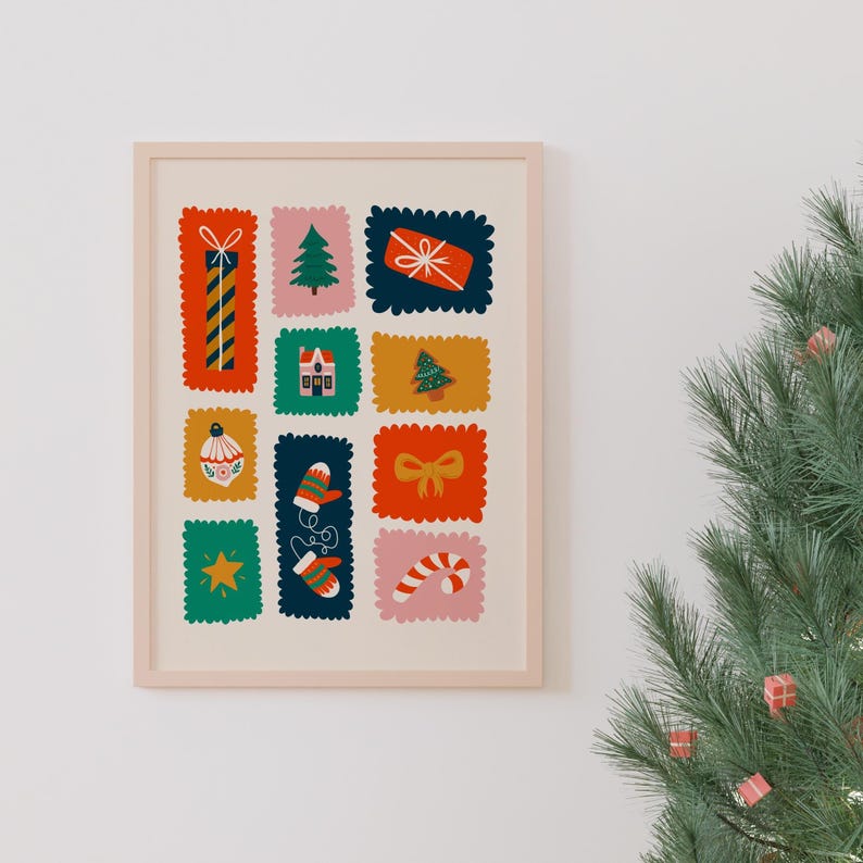 May include: A framed wall art print featuring a grid of twelve colorful, scalloped-edge rectangular patches. Each patch displays a holiday-themed illustration, including a gift, a Christmas tree, a house, a mitten, a bow, and a candy cane.