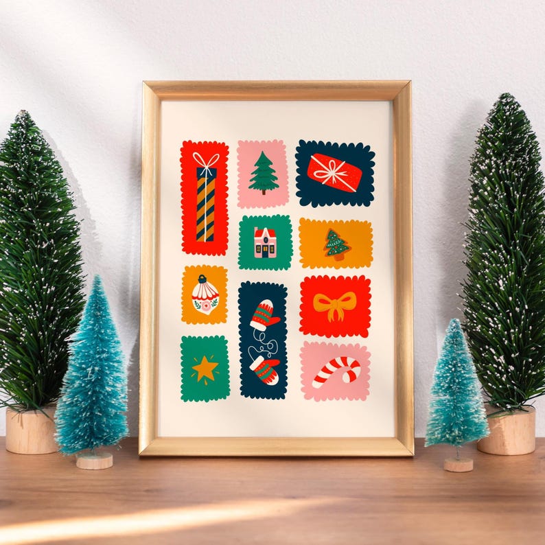 May include: A framed art print featuring a grid of colorful, scalloped-edge rectangular illustrations. The designs include a tall gift, a pine tree, a red present, a house, a small tree, an ornament, mittens, a bow, a star, and a candy cane.