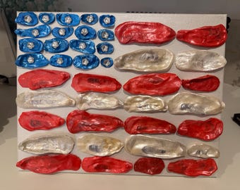 Arte de la bandera estadounidense con conchas de ostra y conchas de alas de ángel