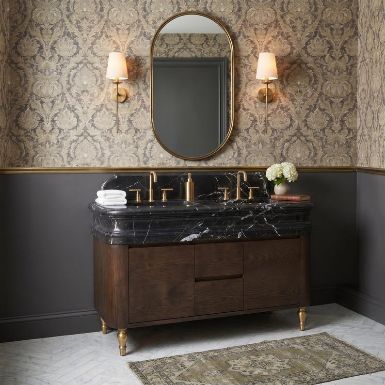 Front view of a luxury master bathroom centered around a handcrafted Nero Marquina double marble vanity with dual integrated sinks, elegant molded stone countertop, brushed brass faucets, rich dark walnut cabinet, oval mirror, decorative wallpaper, and designer lighting for a refined contemporary classic interior.