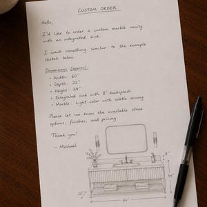 May include: A white sheet of paper with a handwritten custom order for a marble vanity. The text includes dimensions of 60 inches wide, 22 inches deep, and 34 inches high, with an 8-inch backsplash. A pencil sketch shows the vanity design.