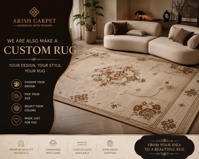 May include: A rectangular area rug with a beige base featuring a central floral medallion and border patterns in muted orange, green, and brown tones. The rug is displayed in a room with a curved beige sofa and includes text about custom rug services.