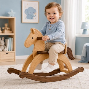 May include: A wooden rocking horse featuring a light-toned body with a darker brown seat, handles, tail, and curved rockers. The horse has a simple, smooth design with a stylised head and neck, providing a stable base for a child to sit and rock.