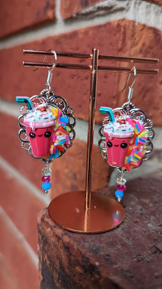 Fake dangle best sale earrings