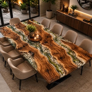 May include: A rectangular dining table featuring two live-edge wood slabs separated by a central river-like channel filled with smooth white river stones and green moss, supported by black metal legs, surrounded by eight beige upholstered chairs.