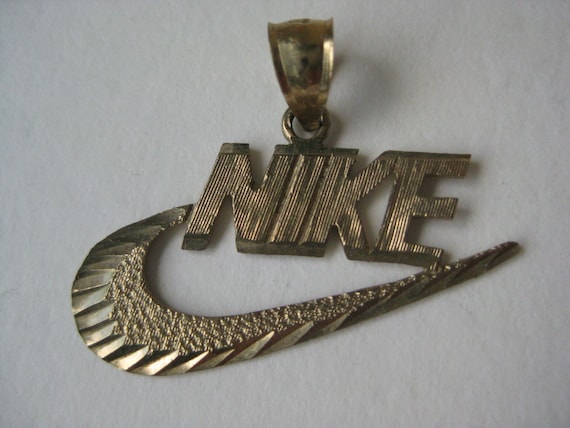 gold nike swoosh