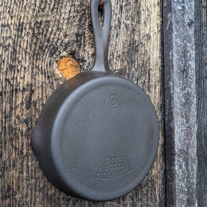 Sold at Auction: Favorite piqua ware cast iron muffin pan #1, EC