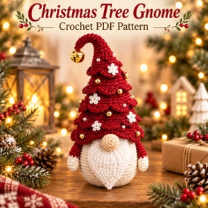 May include: A crochet gnome shaped like a Christmas tree with a red pointed hat, white beard, and a gold bell at the tip. The hat is decorated with small white flowers, gold beads, and pearls. Text at the top reads Christmas Tree Gnome Crochet PDF Pattern.