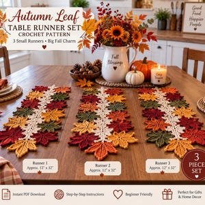 May include: A set of three crochet table runners featuring an autumn leaf pattern in shades of red, orange, yellow, and green. Each runner has a central cream-colored spine and measures approximately 12 inches by 32 inches as labeled in the image.