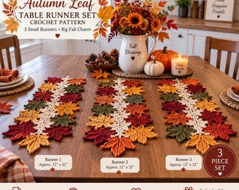 May include: A set of three crochet table runners featuring an autumn leaf pattern in shades of red, orange, yellow, and green. Each runner has a central cream-colored spine and measures approximately 12 inches by 32 inches as labeled in the image.