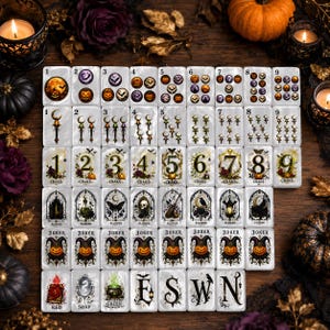 May include: A complete set of rectangular mahjong tiles featuring Halloween-themed illustrations. The tiles display numbered suits with pumpkins, bats, moons, and gothic motifs, alongside Joker tiles and directional markers labeled E, S, W, and N.