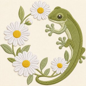 May include: An embroidery design featuring a green lizard curved alongside a circular arrangement of white daisies with yellow centers and green leaves. The lizard has detailed skin texture and large eyes, positioned to frame the floral wreath.