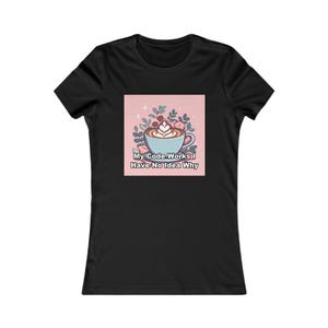 May include: A black short-sleeve t-shirt featuring a central square graphic on a light pink background. The graphic depicts a light blue coffee cup with latte art, surrounded by green leaves and the text My Code Works I Have No Idea Why.