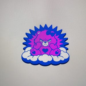 May include: A digital graphic of a fuchsia bear with a dark blue heart on its chest and a bow on its head, displaying an angry expression. The bear sits on a white cloud with a dark blue outline, surrounded by a dark blue starburst shape.