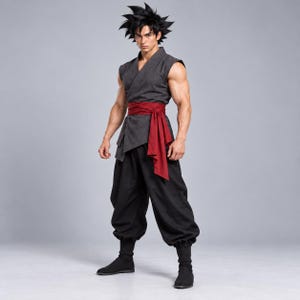 May include: A dark gray sleeveless wrap top with a deep V-neckline, paired with a wide dark red sash tied at the waist. The outfit includes loose-fitting black trousers and black ankle boots, worn by a person with spiky black hair.