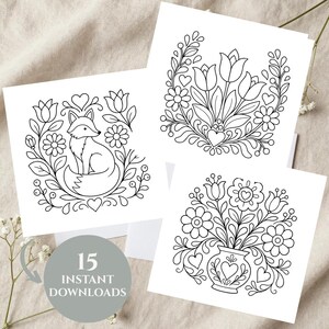 May include: Three square white cards featuring black line art illustrations. One shows a fox surrounded by flowers and hearts, another displays a floral bouquet, and the third depicts flowers in a vase. A gray circle includes the text 15 INSTANT DOWNLOADS.