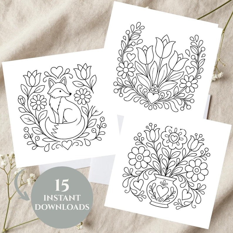 May include: Three square white cards featuring black line art illustrations. One shows a fox surrounded by flowers and hearts, another displays a floral bouquet, and the third depicts flowers in a vase. A gray circle includes the text 15 INSTANT DOWNLOADS.