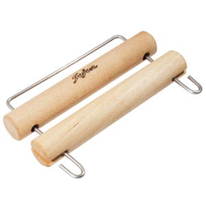 May include: A light-coloured wooden poster hanger consisting of two cylindrical bars connected by a silver metal wire frame. The top bar features the brand name Sujur burned into the wood. The design includes metal hooks for hanging.