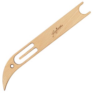 May include: A light-colored wooden weaving shuttle featuring a smooth, elongated body with a curved, pointed tip. The tool includes a circular hole near the base, a long rectangular cutout in the center, and a U-shaped notch at the top. The word Sujur is engraved in cursive script on the surface.
