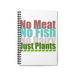 May include: A white spiral-bound notebook featuring the text No Meat, No Fish, No Dairy, Just Plants in stacked lines of brown, teal, light grey, and green, with a row of small green leaf icons printed along the bottom of the cover design.