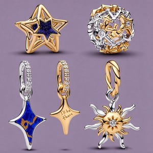May include: A collection of five jewelry charms including a gold star with a dark blue glitter center, a spherical charm with gold and silver star cutouts, two star-shaped dangles with silver loops, and a sun charm with the text I'll be there.