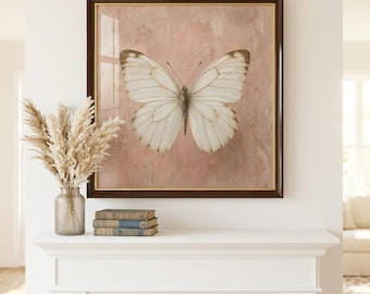 May include: A square wall art piece featuring a white butterfly centered on a textured, dusty pink background. The artwork is enclosed in a dark brown frame with a thin gold inner border, displayed above a white mantelpiece with decor items.