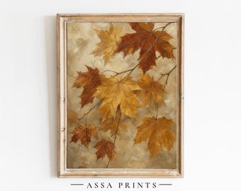 May include: A framed wall art print featuring an oil painting of maple leaves in shades of golden yellow, burnt orange, and deep brown. The leaves are attached to thin branches against a neutral, textured background. The text ASSA PRINTS is visible.