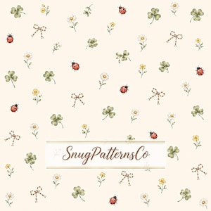 May include: A cream-colored background featuring a repeating pattern of red ladybugs, green clover leaves, small white daisies, yellow wildflowers, and brown checkered bows. The text SnugPatternsCo is centered in a white rectangular box.