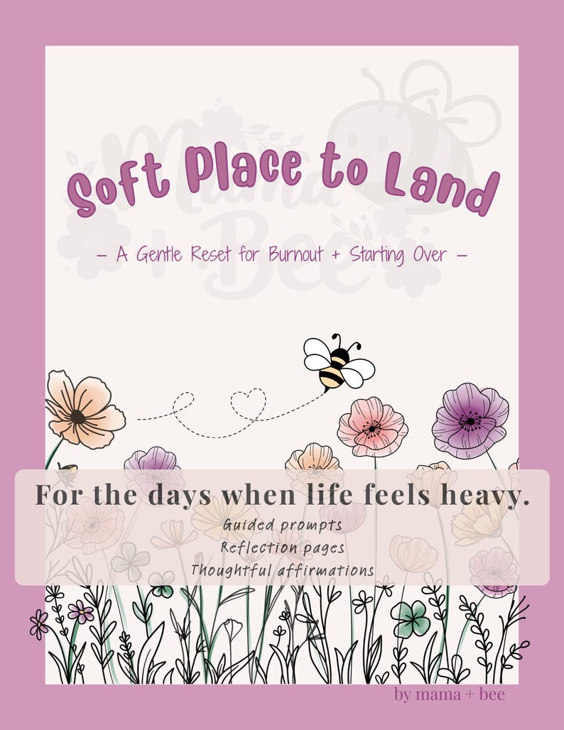 May include: A book cover with a light cream background and a mauve border. The title reads Soft Place to Land - A Gentle Reset for Burnout + Starting Over -. It features a bee illustration, floral line art, and the text For the days when life feels heavy. Guided prompts, Reflection pages, Thoughtful affirmations, by mama + bee.