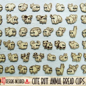 May include: A collection of 47 light-colored wooden bread clips featuring various animal designs, each with a small cutout detail on the rear. The text at the bottom reads 47 DESIGNS INCLUDED CUTE BUTT ANIMAL BREAD CLIPS BY ARTEC.