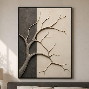 Puede incluir: Una pieza de arte mural rectangular con un diseño dividido en dos paneles, con un lado izquierdo texturizado en gris carbón oscuro y un lado derecho liso de color crema. Una escultura en relieve de una rama de árbol abarca ambas secciones.