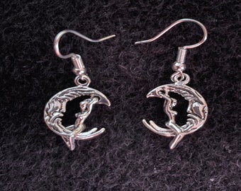 Lady swinging on moon earrings silver