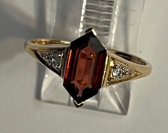 Garnet Ring in !4 Karat Gold with diamond size 6.5