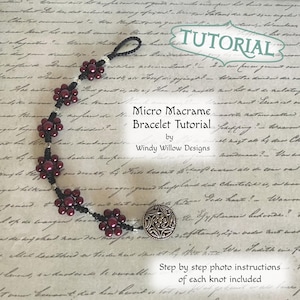 May include: A micro macrame bracelet tutorial by Windy Willow Designs. The bracelet features burgundy beads arranged in floral patterns, connected by black cord. The tutorial includes step-by-step photo instructions. The bracelet is fastened with a decorative silver button.