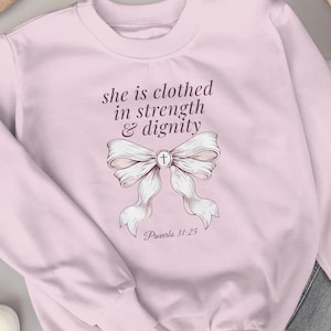 Coquette Christian Sweatshirt, Bow Christian Crewneck, She Is Clothed In Strength Dignity, Proverbs 31 Gift, Faith Sweatshirt Women