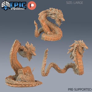 May include: Three tan-coloured dragon miniatures in various poses. One dragon coils around a treasure chest, another is in a curved upright position, and the third is in a serpentine pose. The text "SIZE: LARGE" and "PRE-SUPPORTED" is visible.