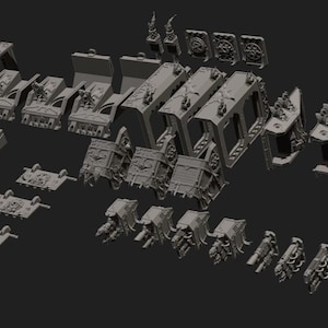 Op de afbeelding: Een verzameling ongeverfde grijze hars miniatuurmodelonderdelen, waaronder voertuigchassiscomponenten, rechthoekige panelen met cirkelvormige emblemen, wapenbevestigingen en structurele frameonderdelen gerangschikt op een donkere achtergrond.