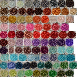 May include: A chart of 96 different colors of round plastic beads. Each color is labeled with a number and a name. The beads are arranged in a grid pattern.