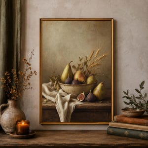 May include: A framed still life painting depicting a ceramic bowl filled with pears, figs, and wheat stalks resting on a wooden table draped with a white cloth. The artwork features muted earth tones, including shades of green, brown, and cream.