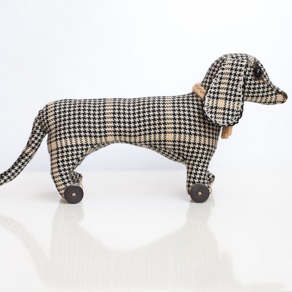 Dachshund, tweed dog. Checkered. Stuffed toy. Personalized. Vintage style, dog on wheels.