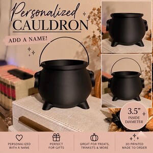 May include: A matte black 3D printed cauldron with a rounded body, three small feet, and a thin metal handle. The cauldron features an open top and a 3.5-inch inside diameter. Text on the image reads Personalized Cauldron, Add a Name, and 3.5 inch inside diameter.