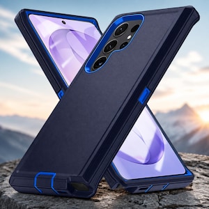 Op de afbeelding: Een robuuste smartphonehoes met een donkerblauwe matte afwerking en levendige koningsblauwe accenten. De beschermhoes heeft een meerlaags ontwerp met versterkte hoeken, nauwkeurige uitsparingen voor de cameralenzen en een gestructureerde grip.