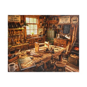 May include: A jigsaw puzzle depicting a cluttered woodworking shop with a workbench, various hand tools, a wood vise, and a mug. Signs on the wall read "Measure twice cut once think always", "Woodworking is not a hobby it's a craft", and "Good work".