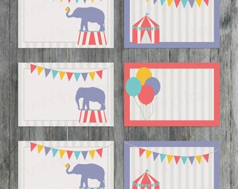 May include: Six printable party favour tags with a circus theme. The tags feature a red and white striped tent, a purple elephant balancing a ball on its trunk, a purple elephant standing on a red and white striped pedestal, and a string of colourful flags.