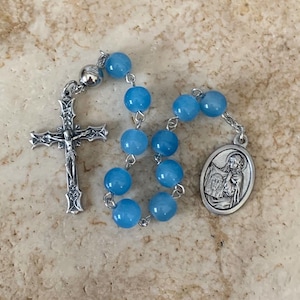 St. Veronica Blue Glass Rosary Tenner