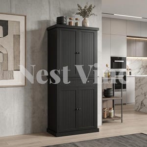 May include: A tall, black kitchen pantry cabinet featuring vertical paneling on the doors, a central drawer, and small round knobs. The cabinet has two upper doors and two lower doors, providing storage space. It stands on a light wood floor.