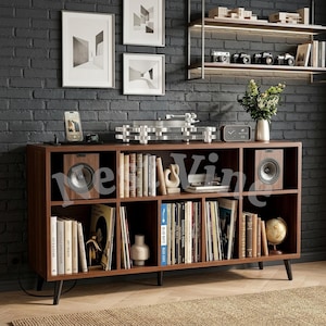 May include: A dark wood media console with eight open storage compartments, featuring two speakers, a turntable, books, vinyl records, a small globe, and a digital clock. The unit stands on four tapered legs against a dark gray brick wall.