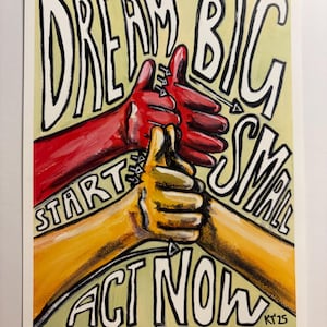May include: A rectangular art print featuring a light yellow background with bold black text that reads DREAM BIG, START SMALL, ACT NOW. The illustration depicts two hands, one red and one yellow, with thumbs pointing upward in a stacked formation.