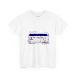 May include: A white short-sleeved t-shirt featuring a central graphic of a computer error window with a yellow warning icon. The text reads: "REAL LIFE NOT FOUND, YOU LIKE TO REBOOT OUTSIDE?" surrounded by a glitch-style digital border effect.