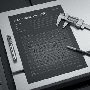 May include: A black toolpath planning sheet with white grid lines and text reading PLAN YOUR SETUPS. It includes a metal end mill, a digital caliper displaying 25.40 mm, and a mechanical pencil. The sheet features technical diagrams.